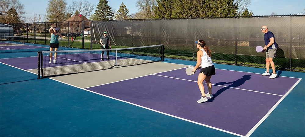 enjoying and playing pickleball