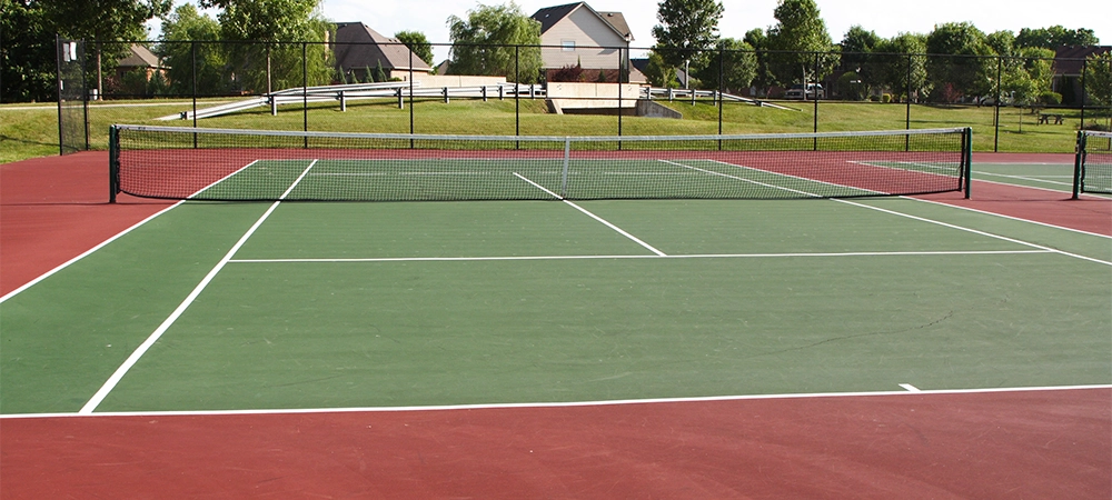 asphalt tennis court playing surface and net