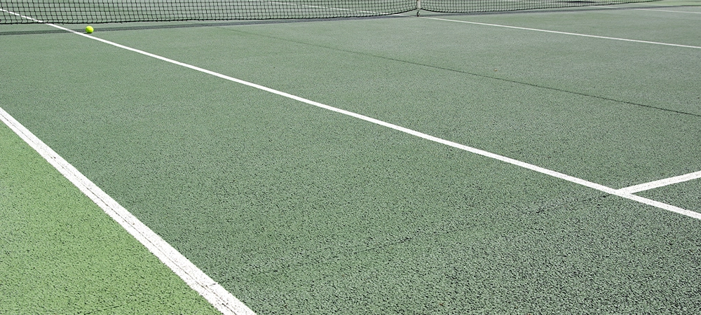 detailed image of an asphalt tennis court