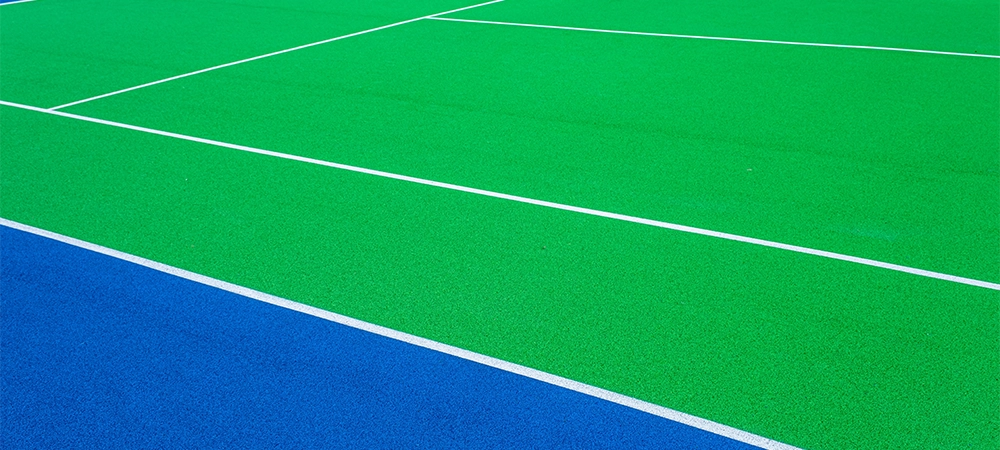 Part of the synthetic grass tennis court with markup