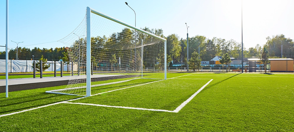 Football field and running track. sport yard. artificial small football field green grass surface. Modern school campus soccer Stadium